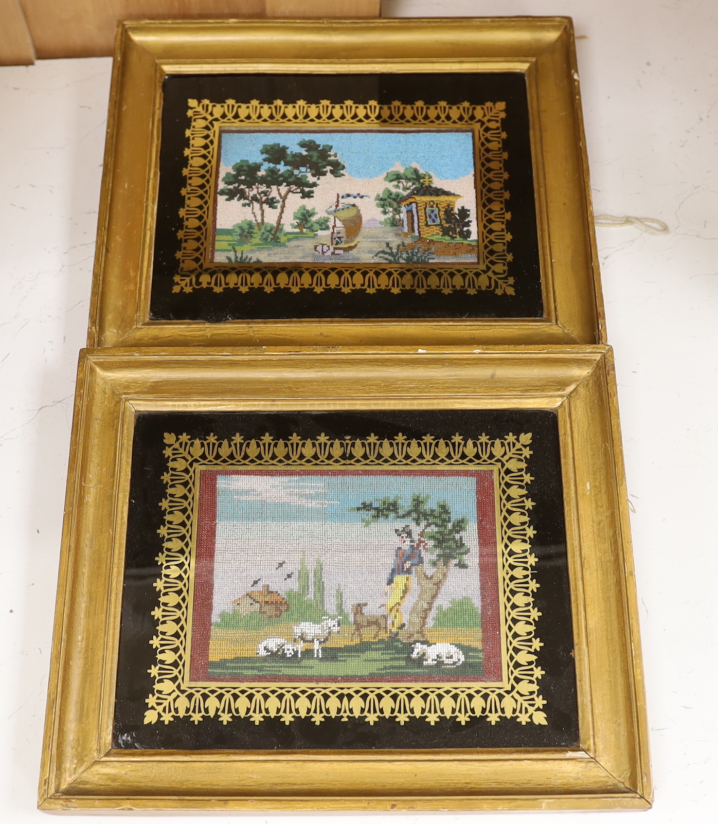 A pair of framed 19th century French beadwork panels, one pastoral scene, the other a boating scene, 19x25cm inside frames
